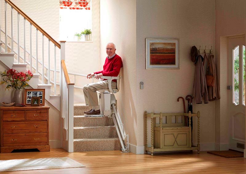 man using a curved stairlift